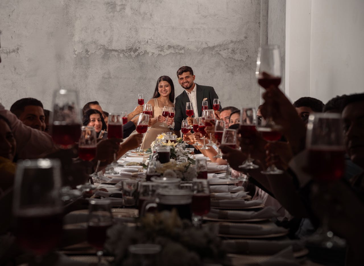 Joyful wedding reception with guests toasting newlyweds in Ecuador.